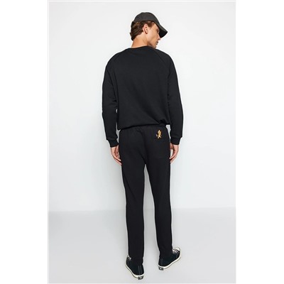Черные мужские лицензированные спортивные штаны с резиновыми штанинами стандартного/нормального кроя с принтом Tom&Jerry TMNAW22EA0297