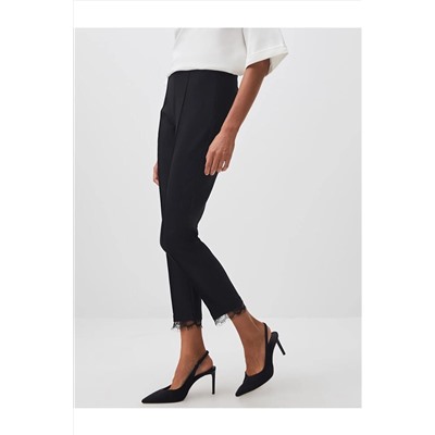 Черные узкие брюки с высокой талией и детальной отделкой